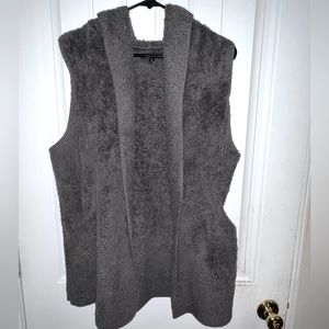 Furry/fluffy vest with hood size small but is oversized